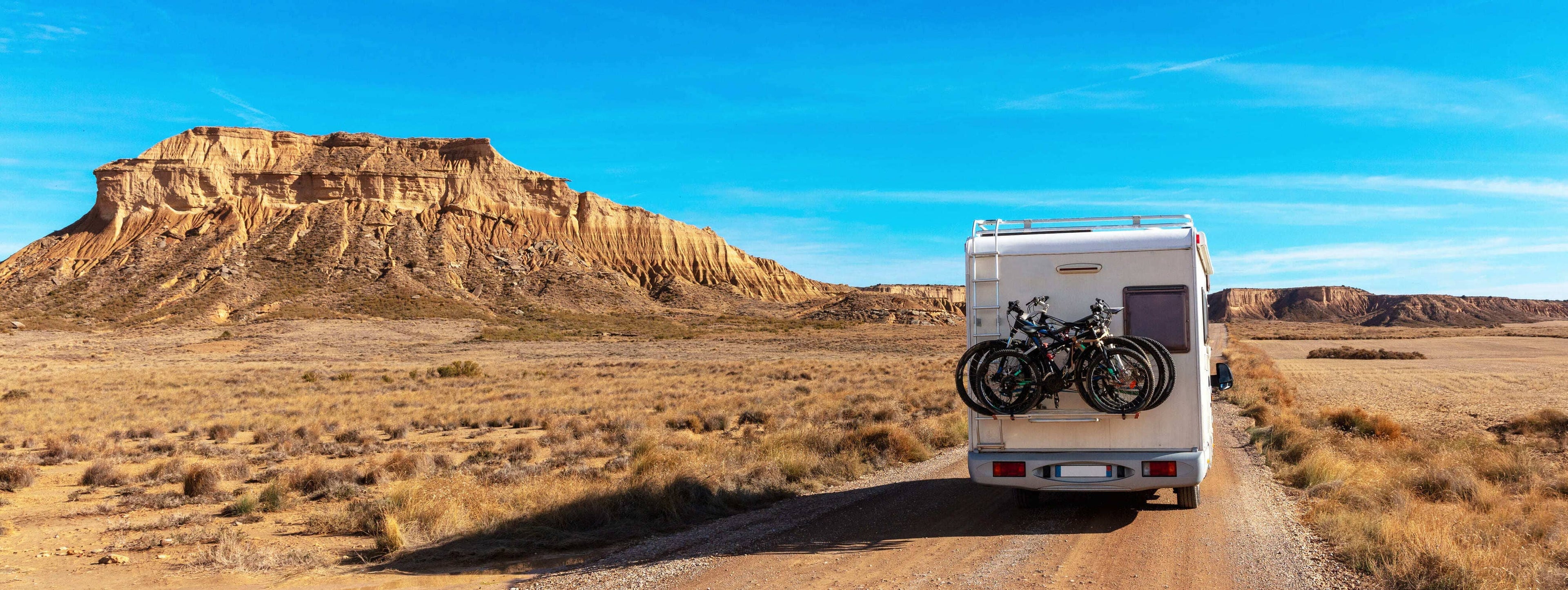 RV driving own a dirt road